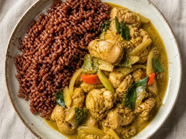 Bhutanese Jasha Maroo Chicken with Red Rice, original finished dish food photograph
