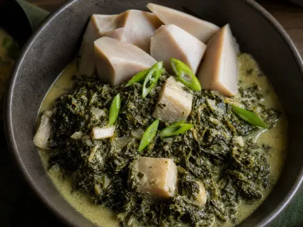Fijian Rourou Coconut Taro Leaf Curry, plated as a finished dinner