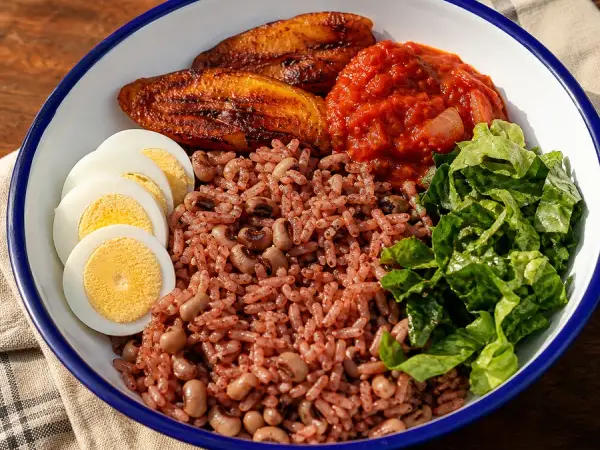 Ghanaian Waakye with egg tomato stew and plantain