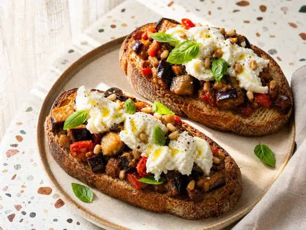 Caponata and burrata piled on toasted sourdough