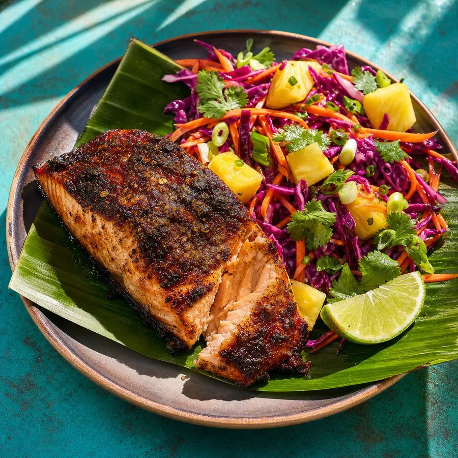 Jerk-crusted salmon fillet with pineapple, purple cabbage, and carrot slaw