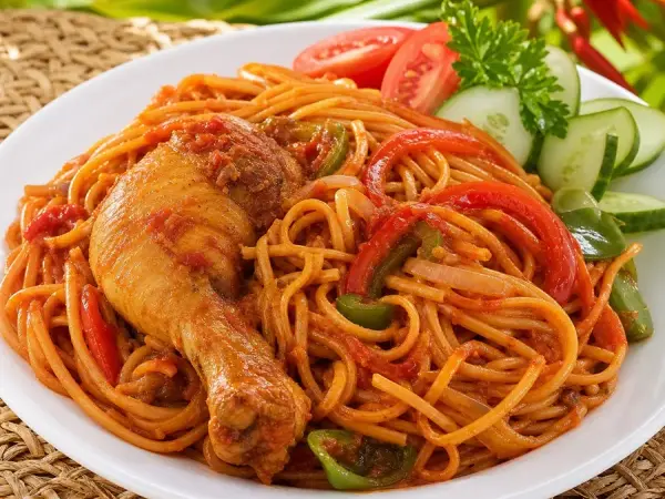 Liberian Jollof Spaghetti with Chicken, plated as a finished dinner