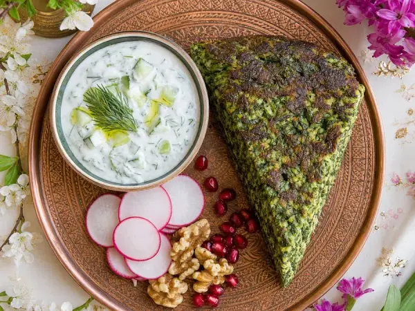 Persian Kuku Sabzi with Cucumber Yogurt, finished dish