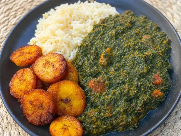 Rwandan-inspired Isombe with fried plantains and rice