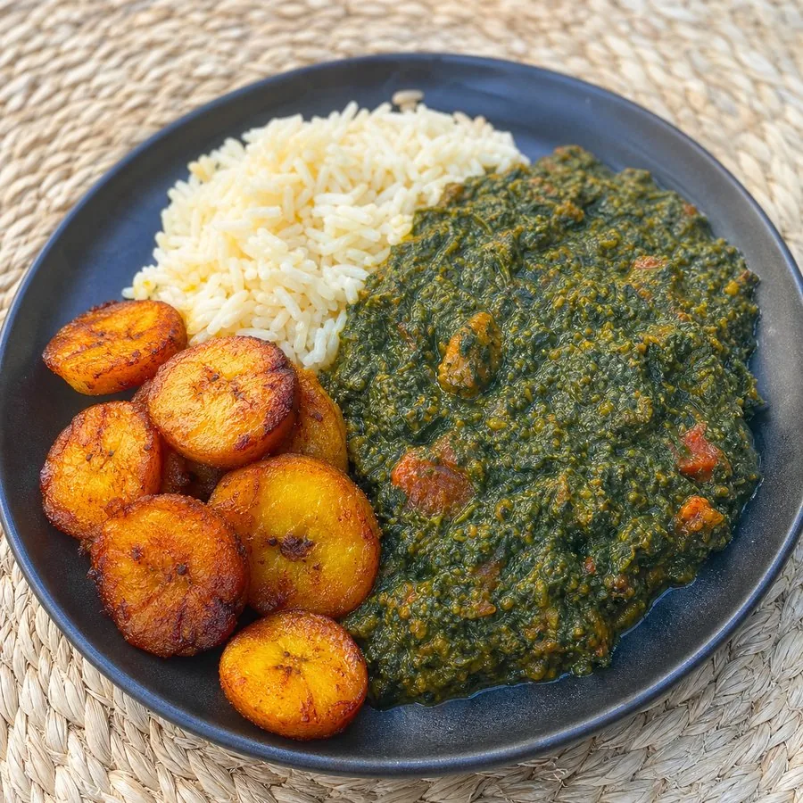 Rwandan-inspired Isombe with fried plantains and rice