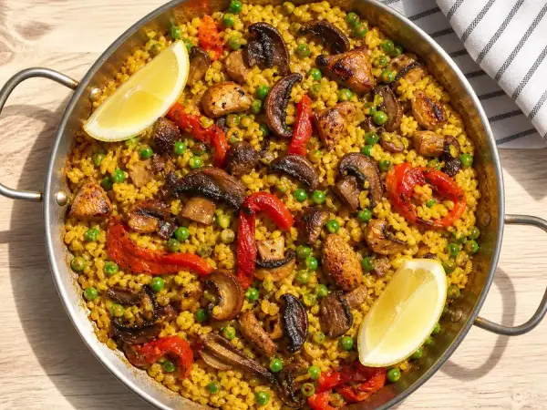 Mushroom paella with peas and roasted peppers