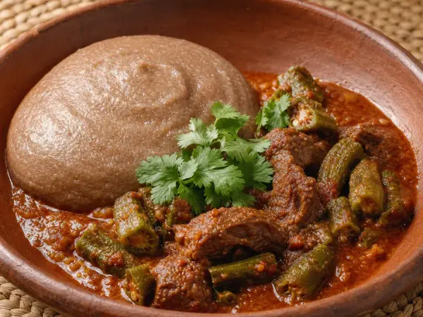 Sudanese Asida Beef and Okra Stew in a clay bowl