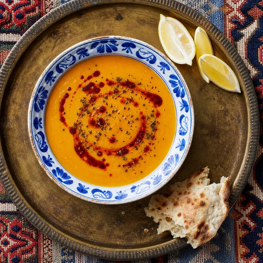 Turkish red lentil soup with Aleppo pepper oil, dried mint, lemon, and flatbread