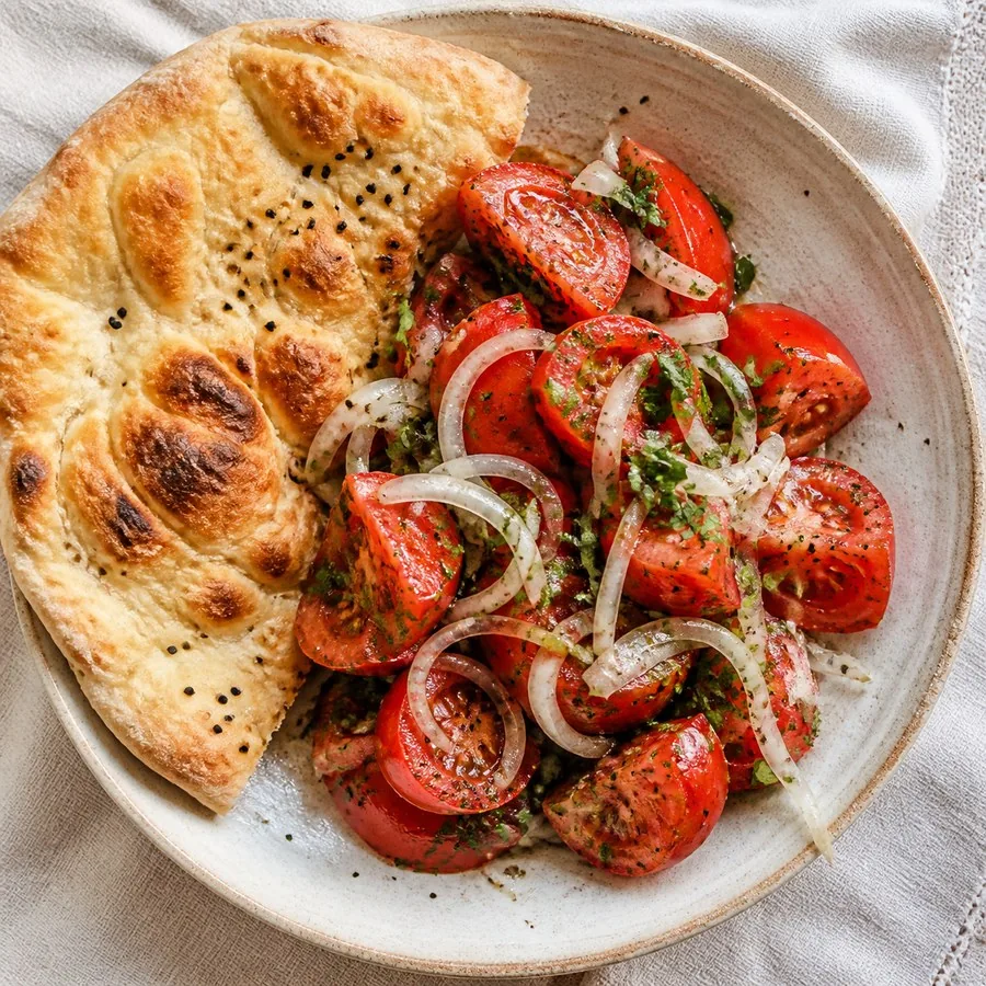Uzbek Achichuk Tomato Salad with Flatbread, original finished dish food photograph